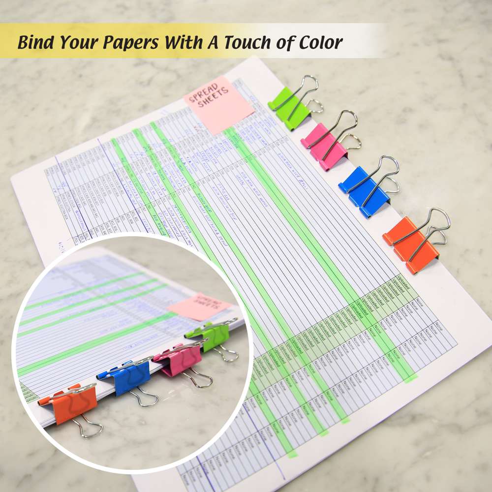 Bind your papers with a touch of color. Green, pink, blue and orange binder clips hold spreadsheets; inset shows close-up.