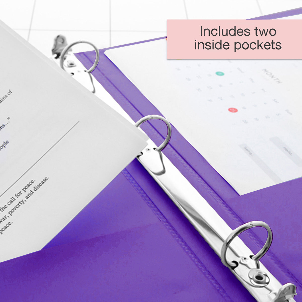 Open purple binder with three silver rings and papers; text states it includes two inside pockets.