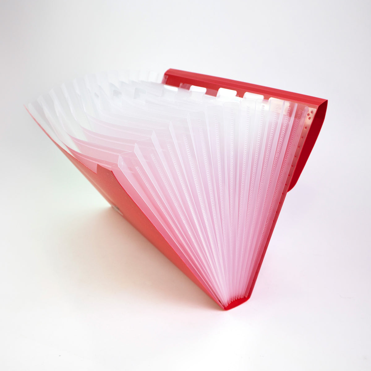 Red expanding file opened wide to show translucent accordion pockets and raised index tabs.