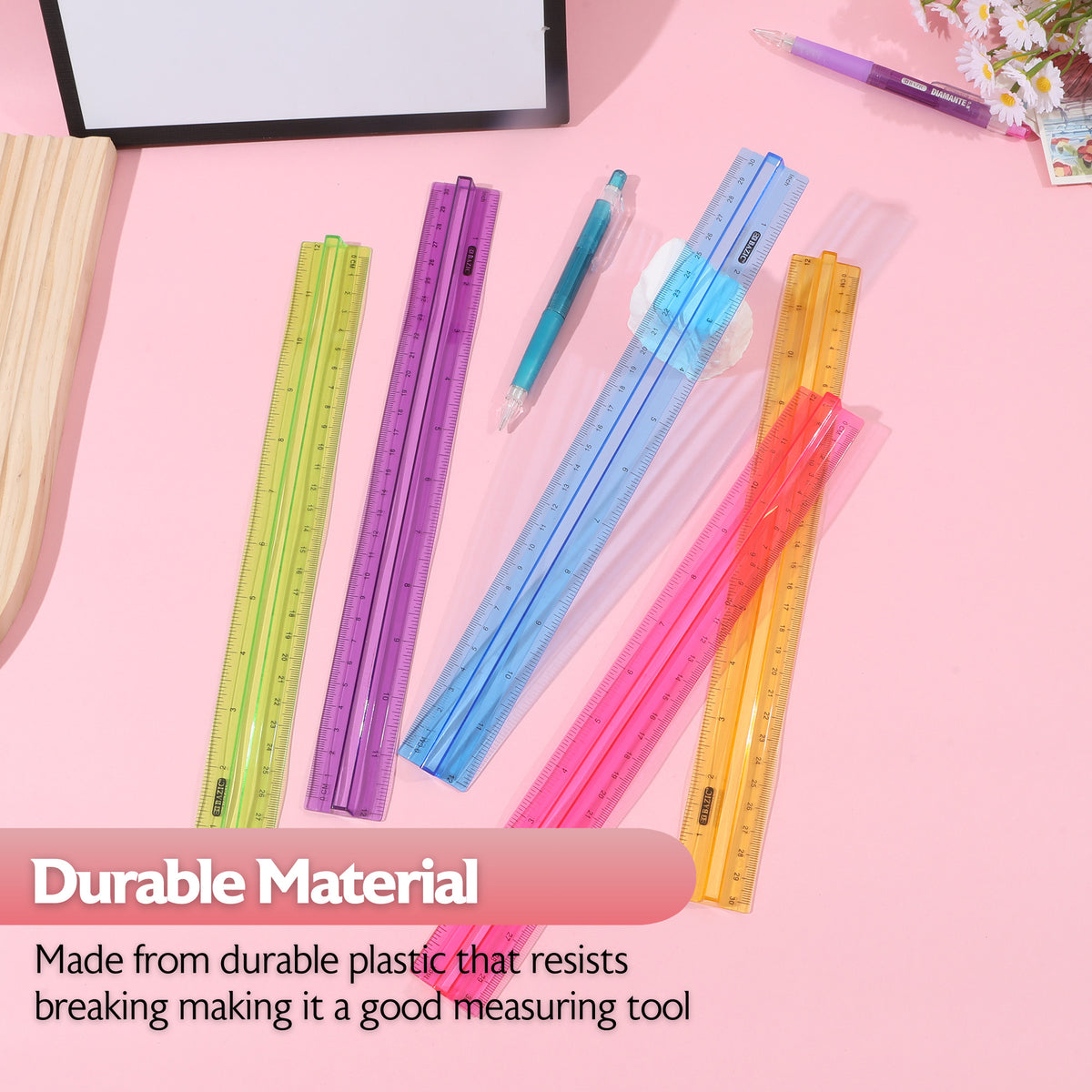 Five translucent grip rulers in green, purple, blue, orange and pink. Durable plastic resists breaking.