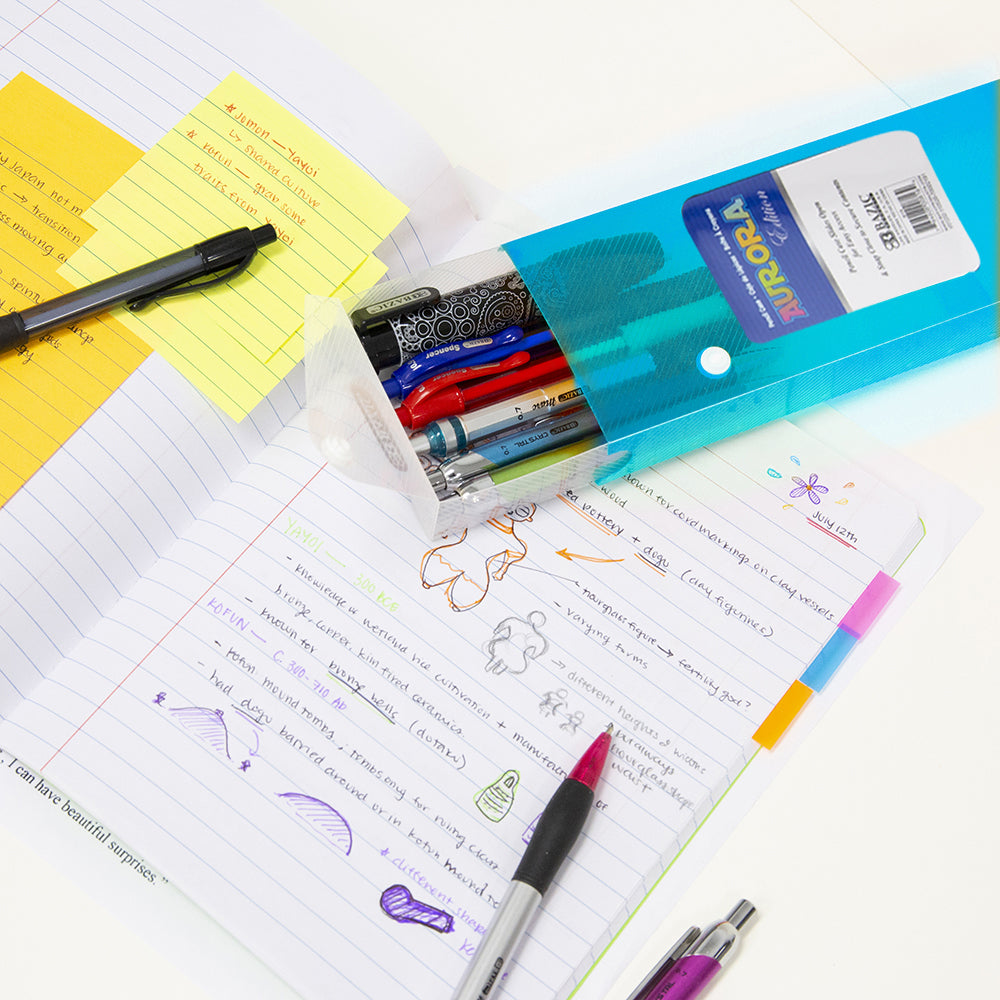 Open turquoise translucent pencil case holds assorted pens on a notebook with handwritten notes and sticky notes.